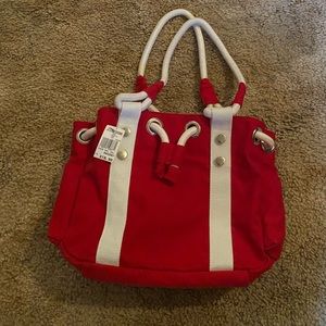 Woman’s red and white hand bag